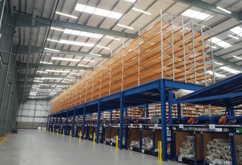 Industrial mezzanine floor above factory machinery